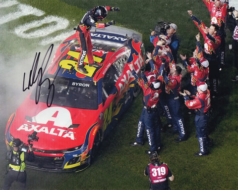 Autographed 2025 William Byron Daytona 500 victory celebration photo showing Byron rejoicing after his historic win with the #24 Axalta car nearby. This signed 8x10 NASCAR collectible includes a COA, makes a great gift, and we are always here to help with any questions.