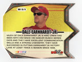A signed Dale Earnhardt Jr. 2002 Wheels High Gear Machine Diecut insert trading card showcasing an eye-catching specialty design from NASCAR's early 2000s era. Featuring Earnhardt Jr.'s autograph and an accompanying Certificate of Authenticity, this collectible makes a great gift for NASCAR fans and vintage racing memorabilia collectors.