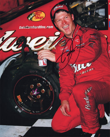 Autographed 8x10 photo of Dale Earnhardt Jr. celebrating in Victory Lane with a post-race beer while standing beside the #8 Budweiser car. The vivid colors and clean signature make this a great gift for NASCAR collectors, and we are always here to help with any questions.