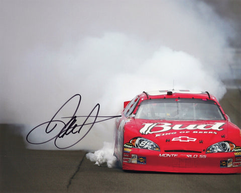Experience the adrenaline of NASCAR with this autographed 8X10-inch glossy photo, showcasing Dale Earnhardt Jr.'s iconic RACE WIN BURNOUT celebration.