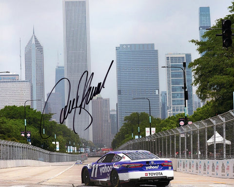 Capture the adrenaline-fueled action of Denny Hamlin at the 2023 Yahoo Racing CHICAGO STREET RACE with this AUTOGRAPHED 8x10 Inch NASCAR Photo, exclusively from Trackside Signatures. Hamlin's exceptional skills shine as he conquers the challenging urban circuit. Rest assured, Trackside Signatures ensures authenticity, with signatures obtained through exclusive public/private signings and privileged garage access via HOT Passes.