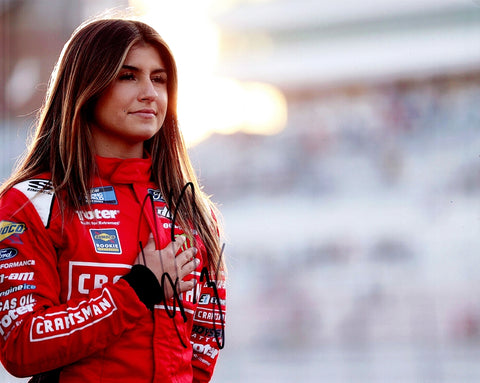 Experience the thrill of NASCAR with an AUTOGRAPHED 2022 Hailie Deegan #1 Craftsman Racing Truck Series 8x10 Inch NASCAR Photo. This iconic collector's piece immortalizes a significant moment as Hailie Deegan embraces the spirit of competition with the pre-race pledge. Her signature, personally obtained through exclusive signings and prized garage area access via HOT Passes.