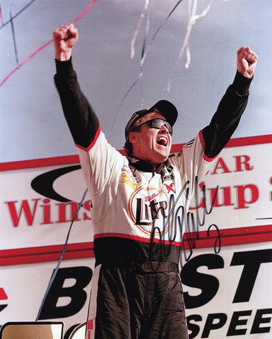 This autographed 2000 Rusty Wallace Bristol win photo showcases the NASCAR legend celebrating his victory. The signed 8x10 glossy photo includes a Certificate of Authenticity (COA), ensuring the legitimacy of the signature and making it a valuable addition to any collection.