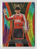 Front view of a Ty Gibbs 2025 Panini Select Racing Selective Swatches Tie Dye NASCAR trading card featuring the Joe Gibbs Racing driver, vibrant multicolor parallel design, and embedded race-used tire memorabilia. This limited-edition collectible is serial numbered #08/25 and appeals to NASCAR fans and racing memorabilia collectors.