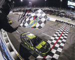 This autographed 2023 William Byron #24 Raptor MARTINSVILLE WIN NASCAR photo captures the exhilarating moment as Byron triumphantly waves the checkered flag at Martinsville Speedway. Each signature is meticulously obtained through exclusive public/private signings and garage area access via HOT Passes, ensuring unparalleled authenticity.